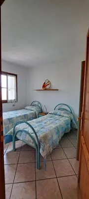 Letto o letti in una camera di Casa Antonella