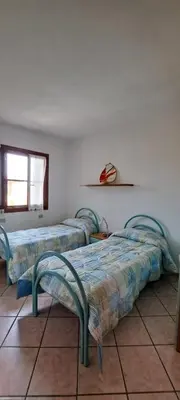 Letto o letti in una camera di Casa Antonella