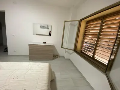Letto o letti in una camera di Appartamento SPRITZ 2 CAMERE MATRIMONIALI 7-9 POSTI LETTO