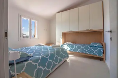 Letto o letti in una camera di GuestHost - Casa Nina - relax close to the beach