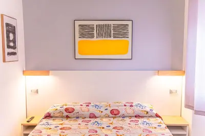 Letto o letti in una camera di Casa Jo del Mare, a pochi passi dalla spiaggia