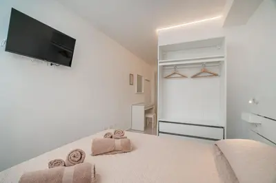 Letto o letti in una camera di Domo de Centro, centro di Olbia