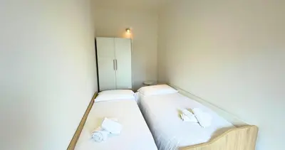 Letto o letti in una camera di Vela House & Garden City Center