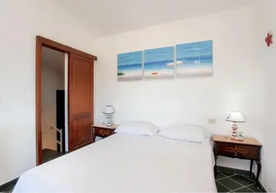 Letto o letti in una camera di HH San Teodoro vista Mare