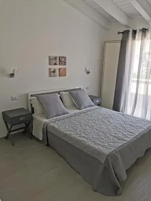 Letto o letti in una camera di Affittacamere Alisso