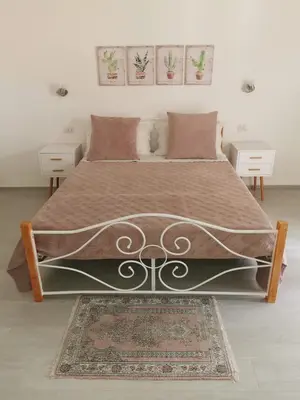 Letto o letti in una camera di Affittacamere Alisso