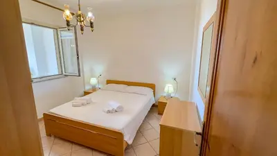 Letto o letti in una camera di Casa Corte del Mar con vista mare