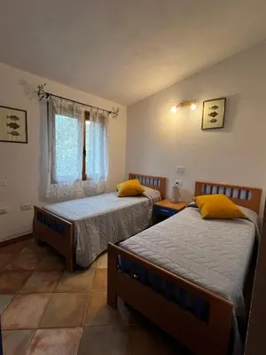 Letto o letti in una camera di Villa Scirocco