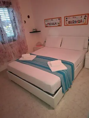 Letto o letti in una camera di Vacation Home in San Teodoro
