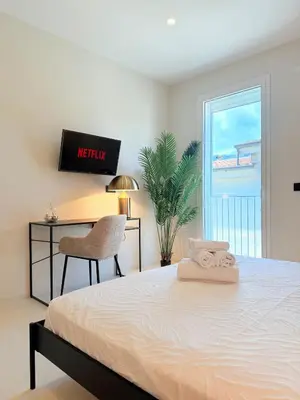 Letto o letti in una camera di I Nidi di Dommos - Camere nel centro storico di Orosei