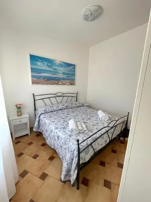 Letto o letti in una camera di Luna di mare Porto Ottiolu