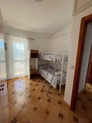 Letto o letti in una camera di Luna di mare Porto Ottiolu