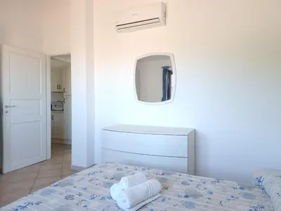 Letto o letti in una camera di Residenza Monte Rena - Rena A3 - Budoni Sweet Home