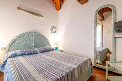 Letto o letti in una camera di Villa Silènis