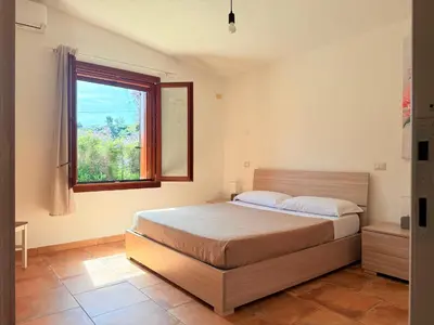 Letto o letti in una camera di Il Glicine - Appartamenti a 4 chilometri dal mare di Orosei