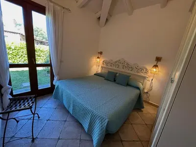 Letto o letti in una camera di Ca' Mirto, una villa vicino a spiagge da sogno