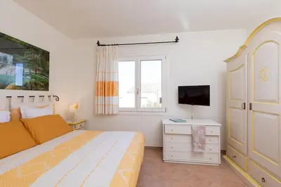 Letto o letti in una camera di Villa with Pool overlooking Tavolara - Porto San Paolo
