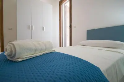 Letto o letti in una camera di EVH Residence San Giovanni