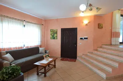 Area soggiorno di Belvedere Apartment Ac, Budoni