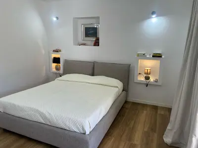 Letto o letti in una camera di L 'alchitti