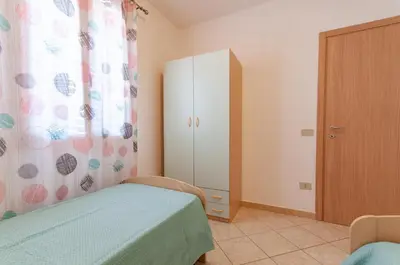 Letto o letti in una camera di Appartamento Pina Caletta sul mare