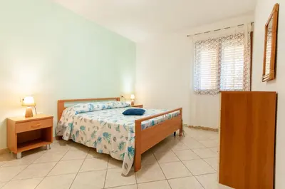 Letto o letti in una camera di Appartamento Salvatore Caletta sul mare