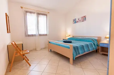 Letto o letti in una camera di Appartamento Valentina Caletta sul mare