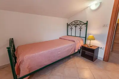 Letto o letti in una camera di Attico vista mare Caletta sul mare