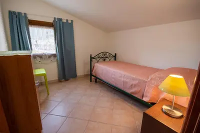 Letto o letti in una camera di Attico vista mare Caletta sul mare