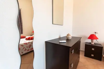Letto o letti in una camera di Attico vista mare Caletta sul mare