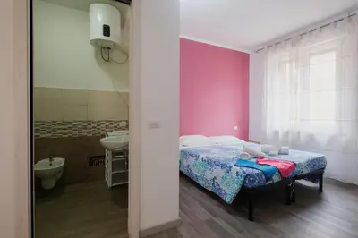 Letto o letti in una camera di BED INN - Palazzo Urbe