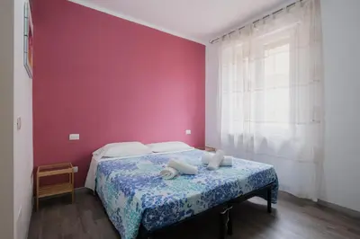 Letto o letti in una camera di BED INN - Palazzo Urbe