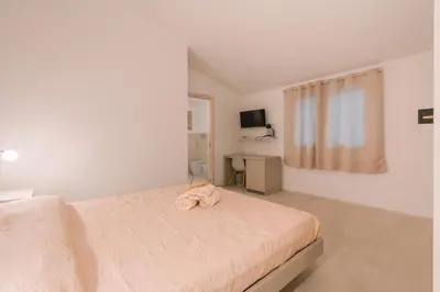 Letto o letti in una camera di Affittacamere Avedí