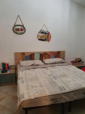 Letto o letti in una camera di Villetta Vacanze Budoni