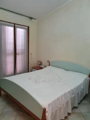 Letto o letti in una camera di Villetta Vacanze Budoni