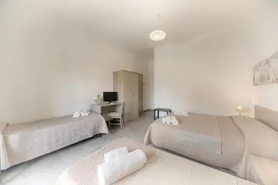 Letto o letti in una camera di Casa Lucia