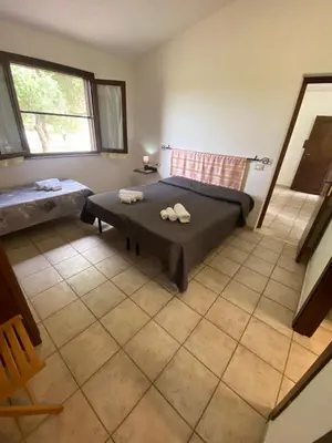 Letto o letti in una camera di Affitta Camere L'Oleandro