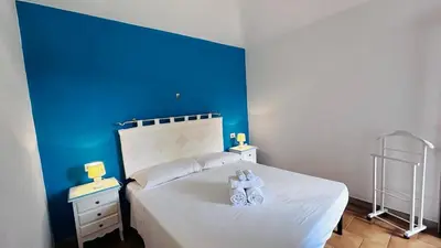 Letto o letti in una camera di Casa MARCO Villaggio Le mandorle