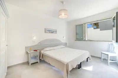 Letto o letti in una camera di Orosei Mare