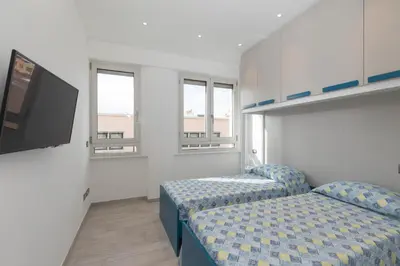 Letto o letti in una camera di Casa Brezza Marina by Wonderful Italy