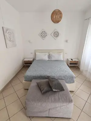 Letto o letti in una camera di Olbia City House