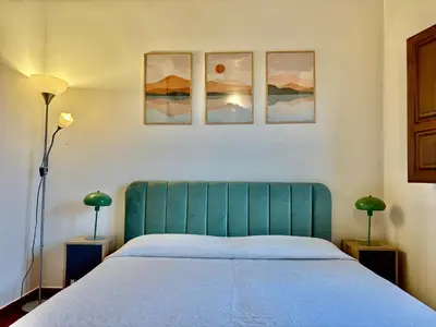 Letto o letti in una camera di Villetta Felicità SAN TEODORO