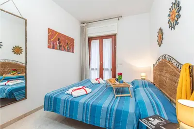 Letto o letti in una camera di Scacciapensieri - Happy Rentals
