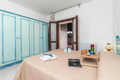 Letto o letti in una camera di Scacciapensieri - Happy Rentals