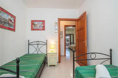 Letto o letti in una camera di Scacciapensieri - Happy Rentals