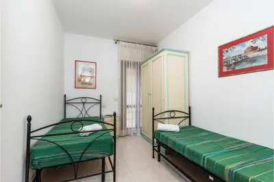Letto o letti in una camera di Scacciapensieri - Happy Rentals