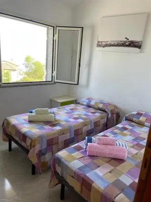 Letto o letti in una camera di Bellavista Cala Gonone