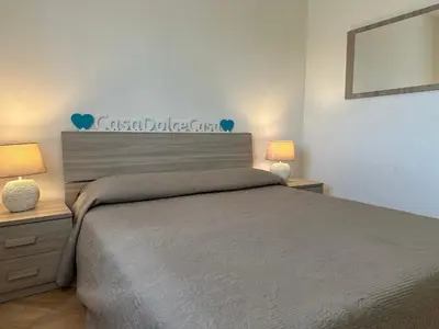 Letto o letti in una camera di Casa Dolce Casa - con piscina a un passo dal mare
