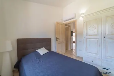 Letto o letti in una camera di Villa Filomena - By Searly
