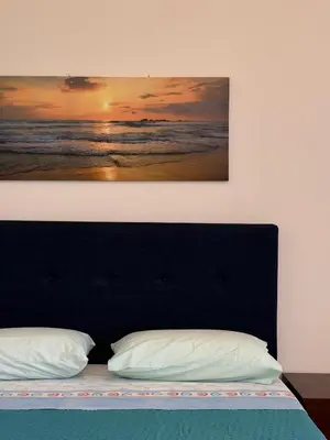 Letto o letti in una camera di Affittacamere Belvedere - Posada
